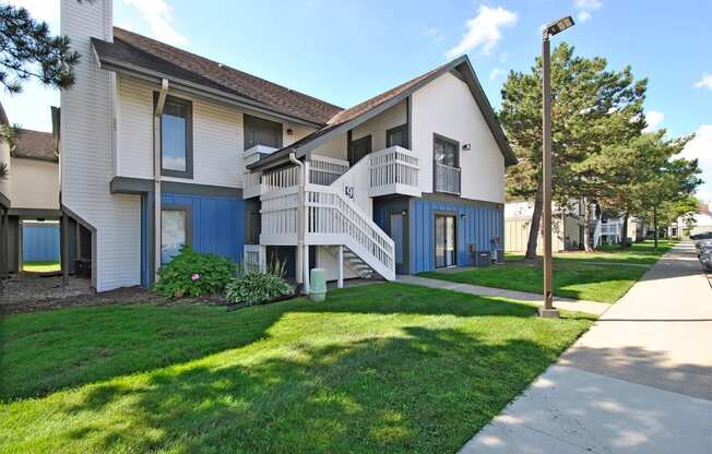 apartments located in a quiet neighborhood with a sidewalk