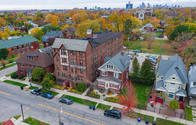 an aerial view of a brick building on a city street