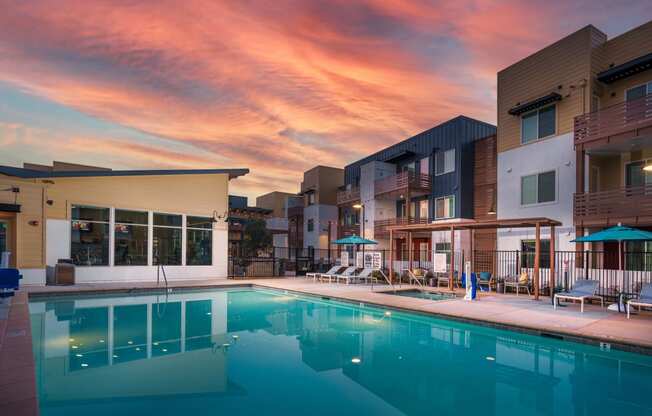 Pet-Friendly Garden-Style Apartments in Rancho Cordova, CA - Aurora - Gated Pool with Lounge Chairs, Umbrellas, Pergola, and Spa.