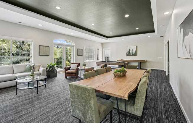 A modern dining room with a wooden table and chairs.