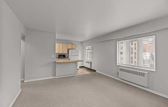 A room with a desk and a window