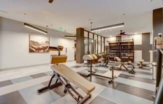 a room filled with lots of different types of exercise equipment