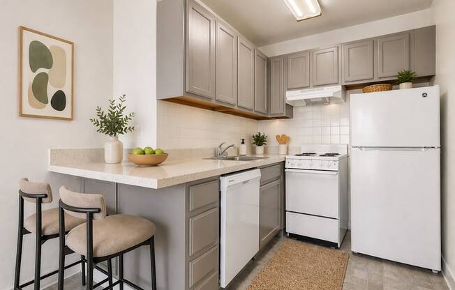 A kitchen with white appliances and a white refrigerator.