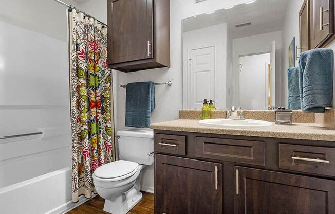 a bathroom with a toilet and a sink