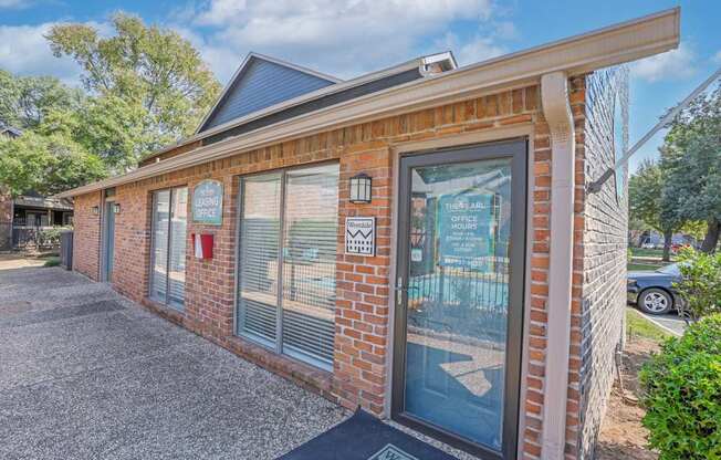 A brick building with a sign that says "The Pine" on it.