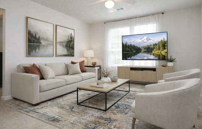 A living room with a couch, a chair, a coffee table, and a television displaying a mountain landscape.