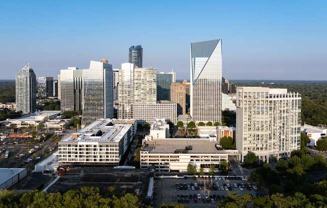 an aerial view of a city skyline with tall buildings and skyscrapers