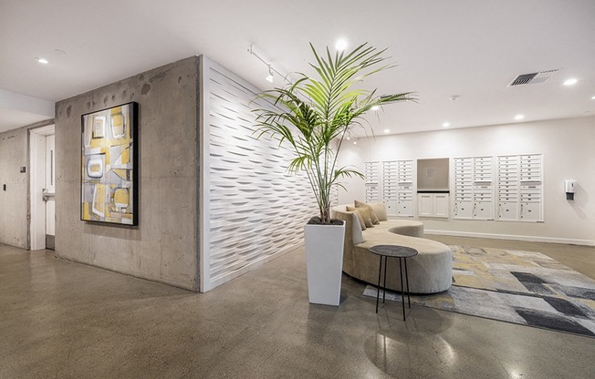 Mail room with seating and decorations Rasa Apartments