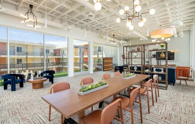 a large room with a long wooden table and chairs
