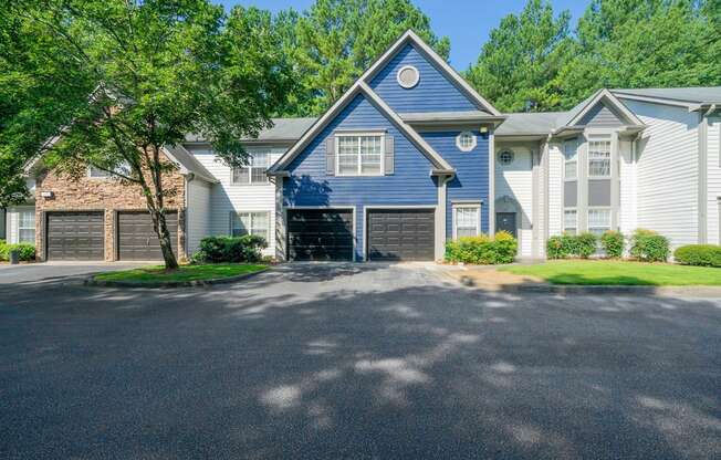 front of apartment building with garages