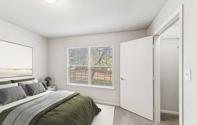 Model Living Room with Carpet and Walk In Closet at Lake Cameron Apartments located in Apex, NC.