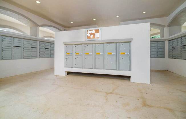 A room with a white cabinet and a brown floor.