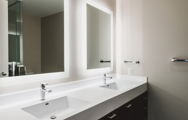 Enjoy to convenience of dual vanity with mirrors lit with LED lighting