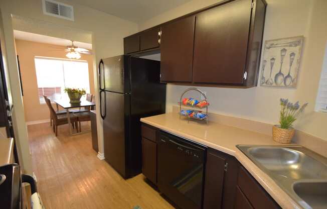 Three Bedroom Apartments in Antelope Valley CA - The Arches at Regional Center West - Modern Kitchen with Wood-Style Cabinets