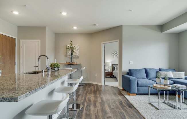 Open floor plan with kitchen, dining and living room at Ascend at Woodbury MN 55129 new luxury apartments