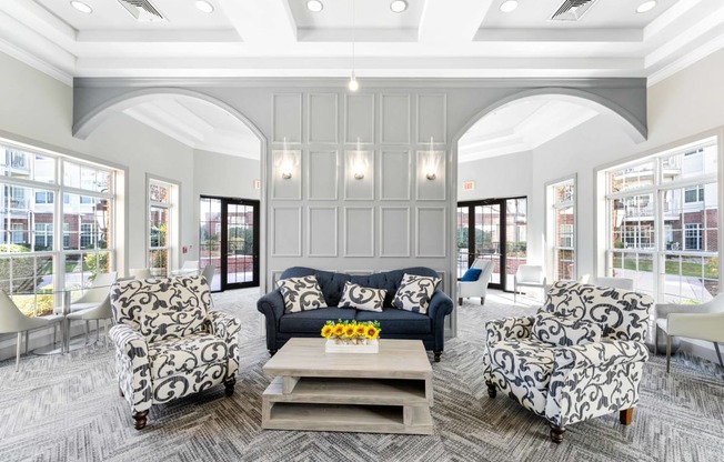 a living room filled with furniture and a large window  at The Lena, Raritan, NJ