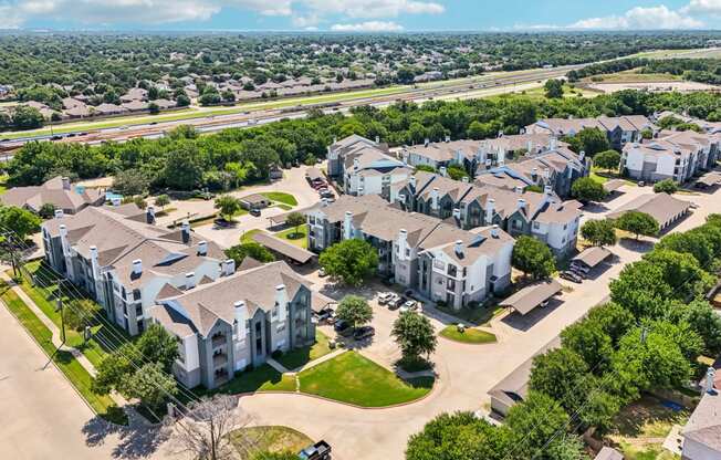 an aerial view of a neighborhood with houses and trees