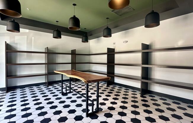 a small table in a room with a black and white checkered floor