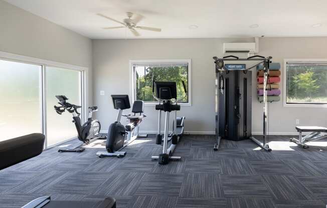 a gym with treadmills and other exercise equipment in a building