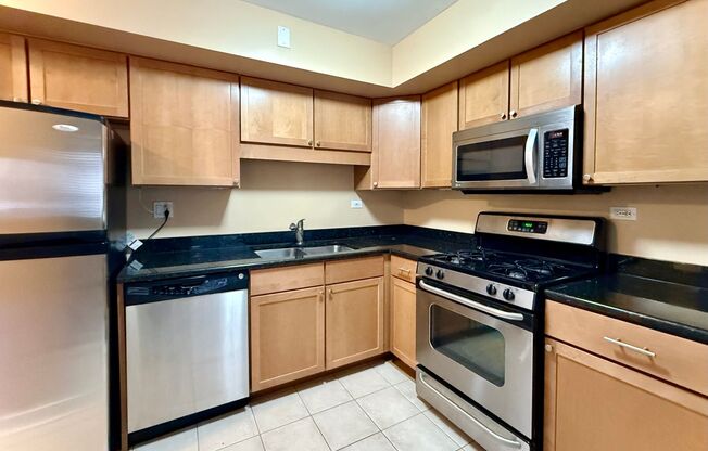 Pristine 2 Bedroom, 1 Bathroom Condo Available NOW! Heat, Water, & Parking INCLUDED in Rent!