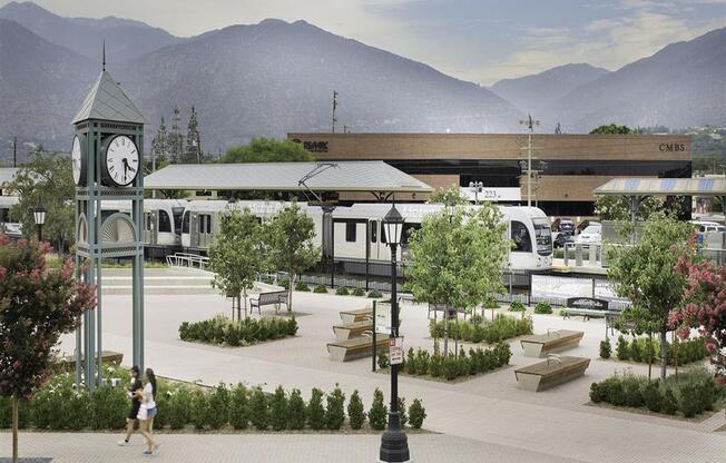 a clock tower sitting in the middle of a park