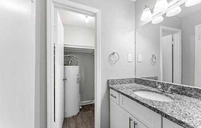 a bathroom with a sink and a mirror  at Balfour 296, Lilburn