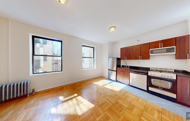 201 205 W 11 ST