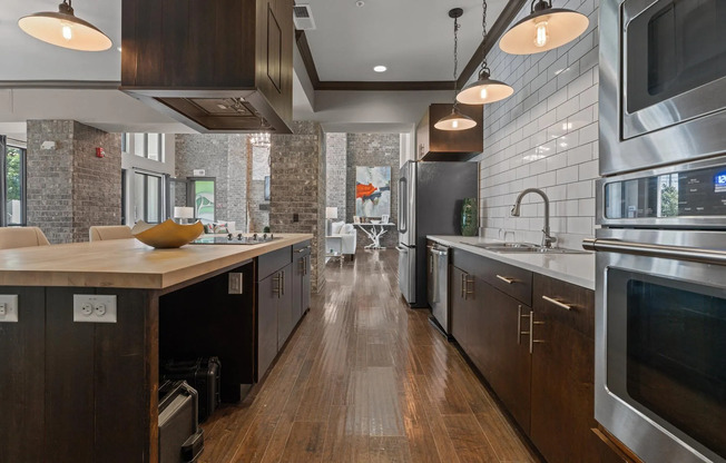 Apartments for Rent in Little Rock, AR - Riverhouse Kitchen With White Appliances, and Modern Wood Cabinets