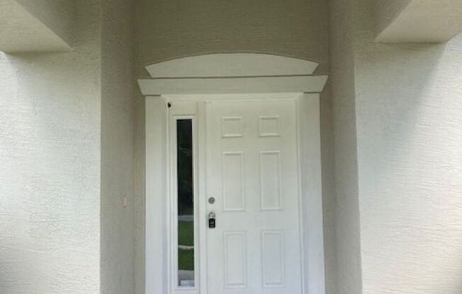 Spacious 4/2/2 Home with Screened-In Porch and Stylish Finishes