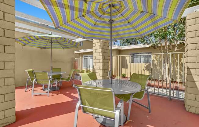 Capistrano Gardens Seating Area with chairs and umbrellas