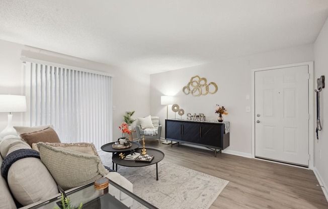 our apartments offer a living room with a couch and a tv at St. Andrews Reserve, North Carolina, 28412
