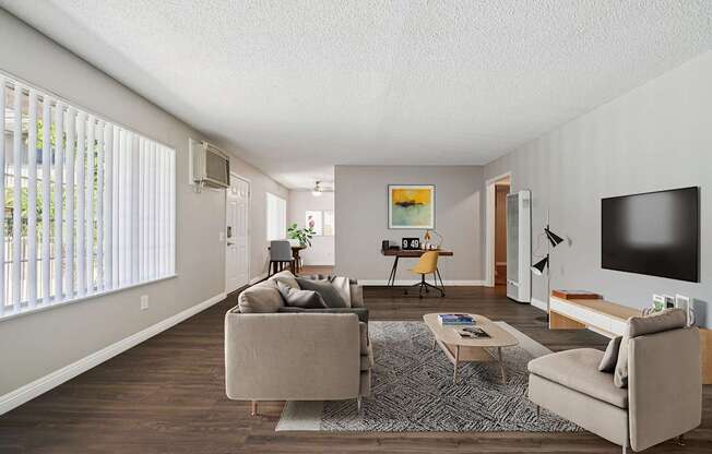 A living room with a couch, chair, and television.