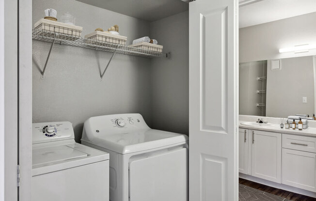 a white washer and dryer in a room