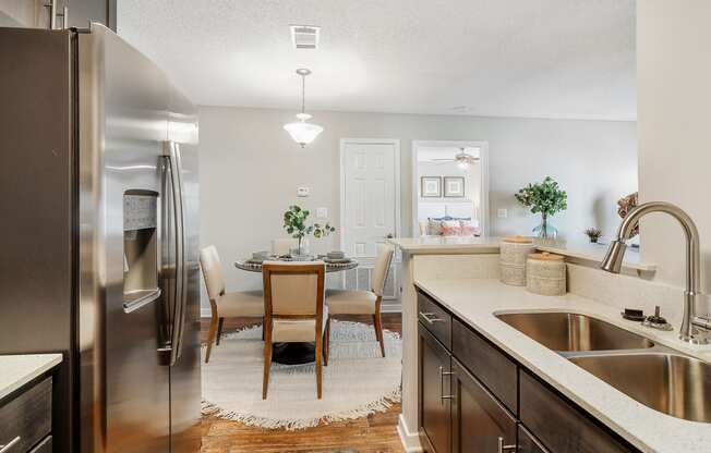 our spacious kitchen and dining room are open to the living room and family room at Reserve of Jackson Apartment Homes, Jackson, MS, 39211