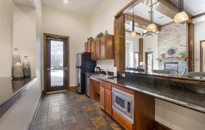 Kitchen in Clubhouse at Avena Apartments, CO