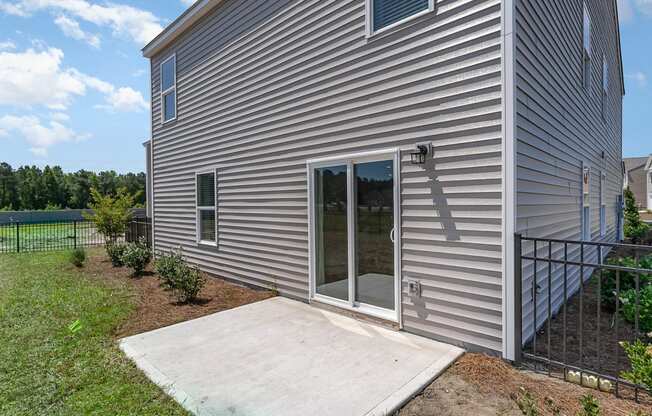 a ramp leads to the back door of the home