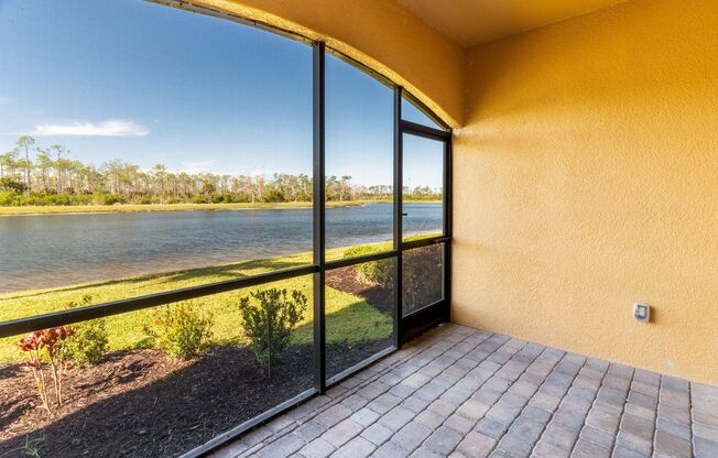 Stunning 2BR/2BA Acqua Ct. First-Floor Unit with Lake Views in Treviso Bay – Resort-Style Living Awaits!
