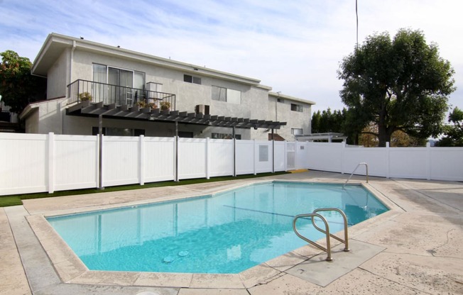 Gated pool with lounging area at Cedar Glen.
