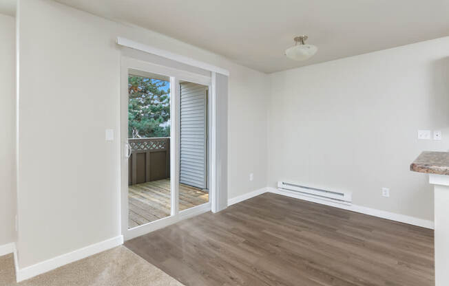 A room with a door leading outside.