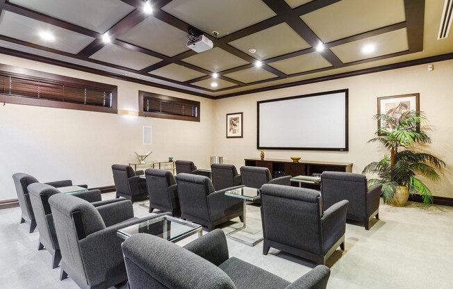 A conference room with a long table and chairs.