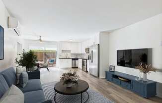A modern living room with a grey sofa and a coffee table.