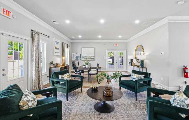 a living room with couches and chairs and a table