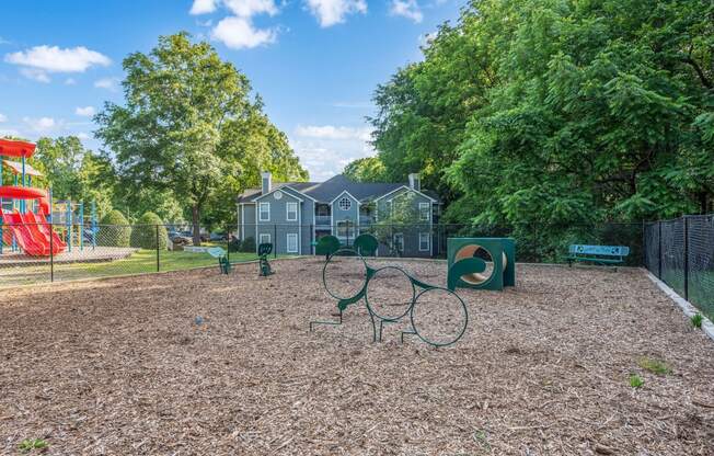 a park with a playground and a house in the background