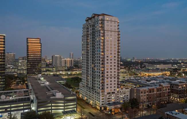 a view at night of the building at Dominion Post Oak in Houston, TX