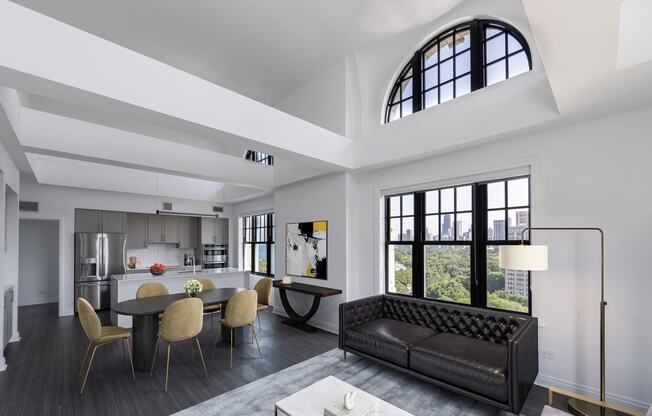 a living room with a couch and a table with chairs  at The Belden Stratford, Chicago, IL
