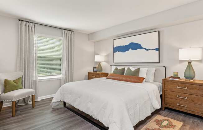 a bedroom with a large bed and a window