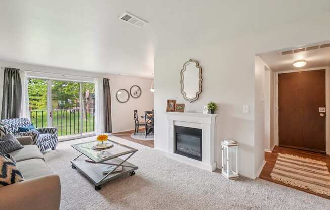 Elevated living room and private patio or balcony at Drawbridge Apartments in Harrison Township, MI.