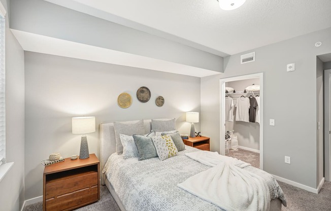a bedroom with a bed and a closet