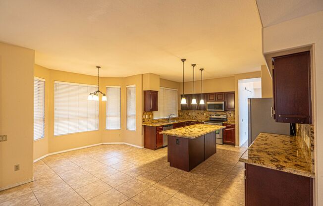 Sprawling  Val Vista Lakes 4 Bed, 3 Bath Home with Resort-Style Backyard!