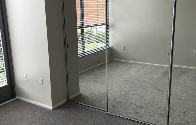 Master bedroom of Allure floorplan with mirrored glass closet